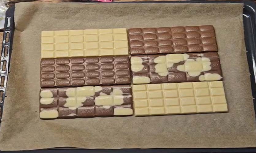 Schokolade auf das Backblech legen und im Backofen schmelzen